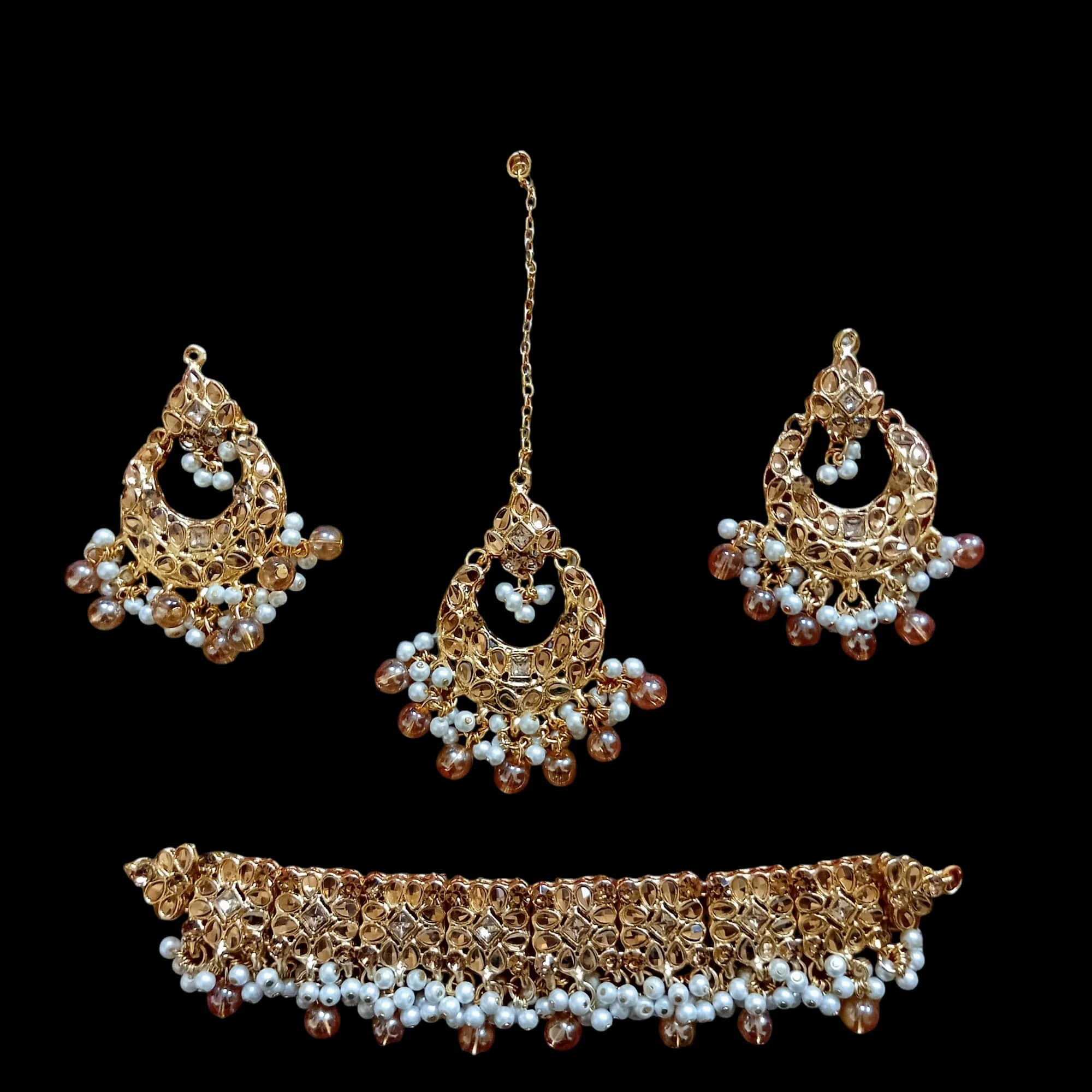 Buy Golden colour jewellery set with necklace , earrings and tikka at best price in pakistan